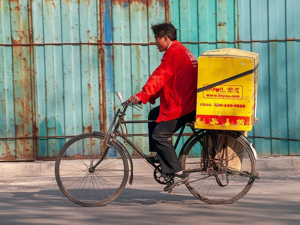 Bicycle courier riding through the city